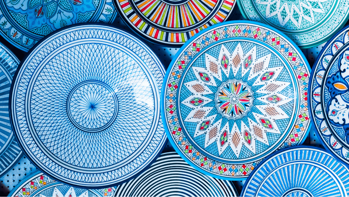 blue patterned tagines in a souk in morocco
